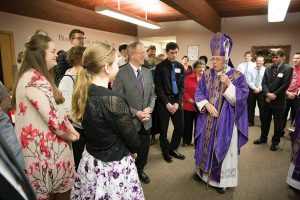 Bishop Swain visits with confirmation students and sponsors before Mass